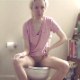 A pretty blonde girl sits on a toilet, pisses and strains to take a shit with small, hard, audible plops. She returns to the toilet and has better luck. Nice constipation scenes with farting, too. 720P HD. 207MB, MP4 file. Over 13 minutes.